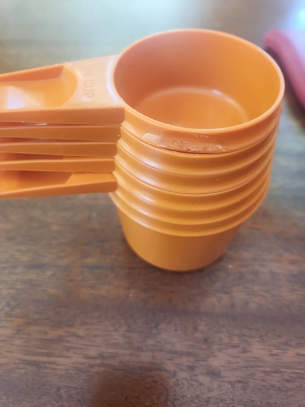 TupperwareOrange Plastic Measuring Cups Plus Other Helpful Kitchen Items